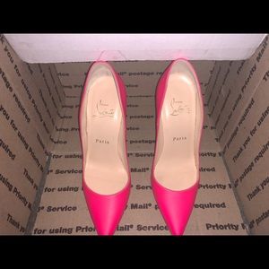 Christian Louboutin pink and while heels.